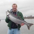 A man holding a large fish in his hands.