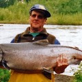 A man holding a large fish in his hands.