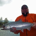 A man holding a fish in his hands.