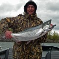 A man holding a large fish in his hands.