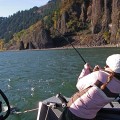 A woman is fishing on the water