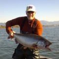 A man holding a fish in his hands.