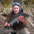 A man holding a fish in his hands.