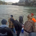 A group of people fishing on the water.